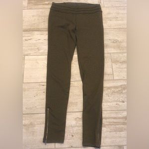 Hunter green leggings with zippers on sides. Size medium.